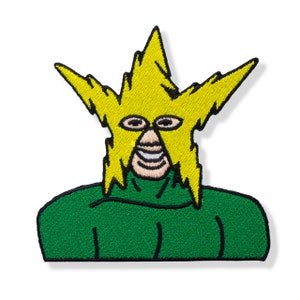 May include: Embroidered patch featuring a stylized character with a yellow lightning bolt-shaped head and a green torso. The character has a smiling face with visible teeth and oval eyes. The patch is designed for application on clothing or accessories.