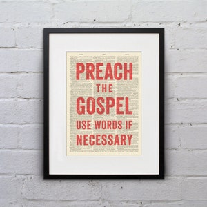 May include: A framed print with a vintage dictionary page background. The text "Preach the Gospel Use Words If Necessary" is printed in red.