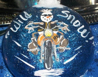 it's "WILD SNOW" Handpainted snowman on a 3" flat glass ornament w/blue glitter interior - All Original Design