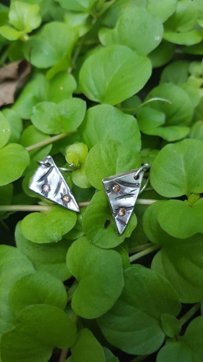 Geometric cast in place earrings