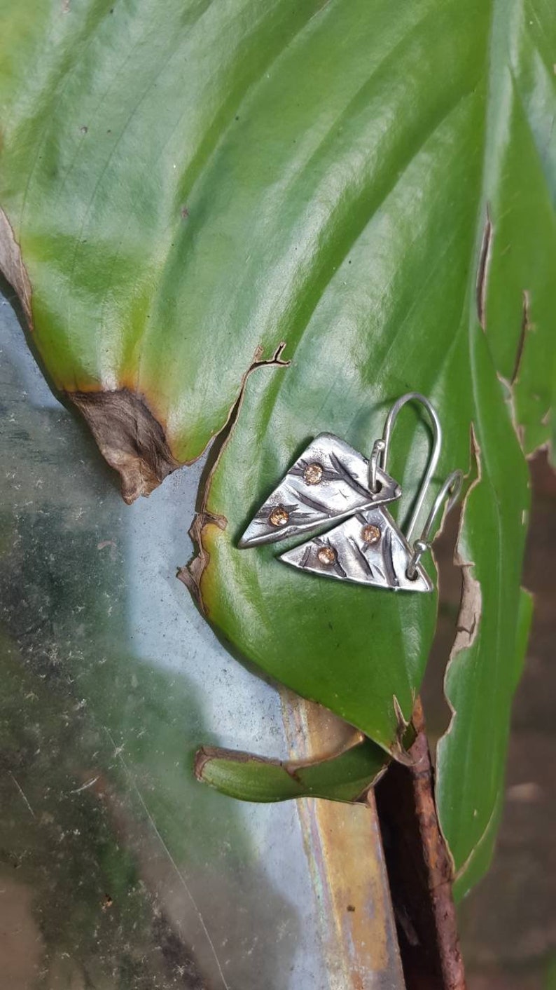 Geometric cast in place earrings