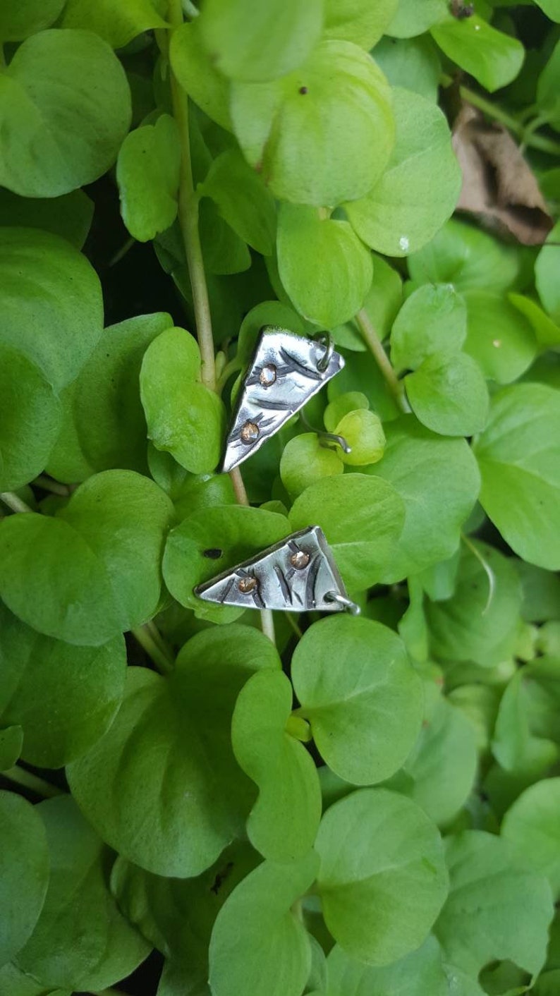 Geometric cast in place earrings
