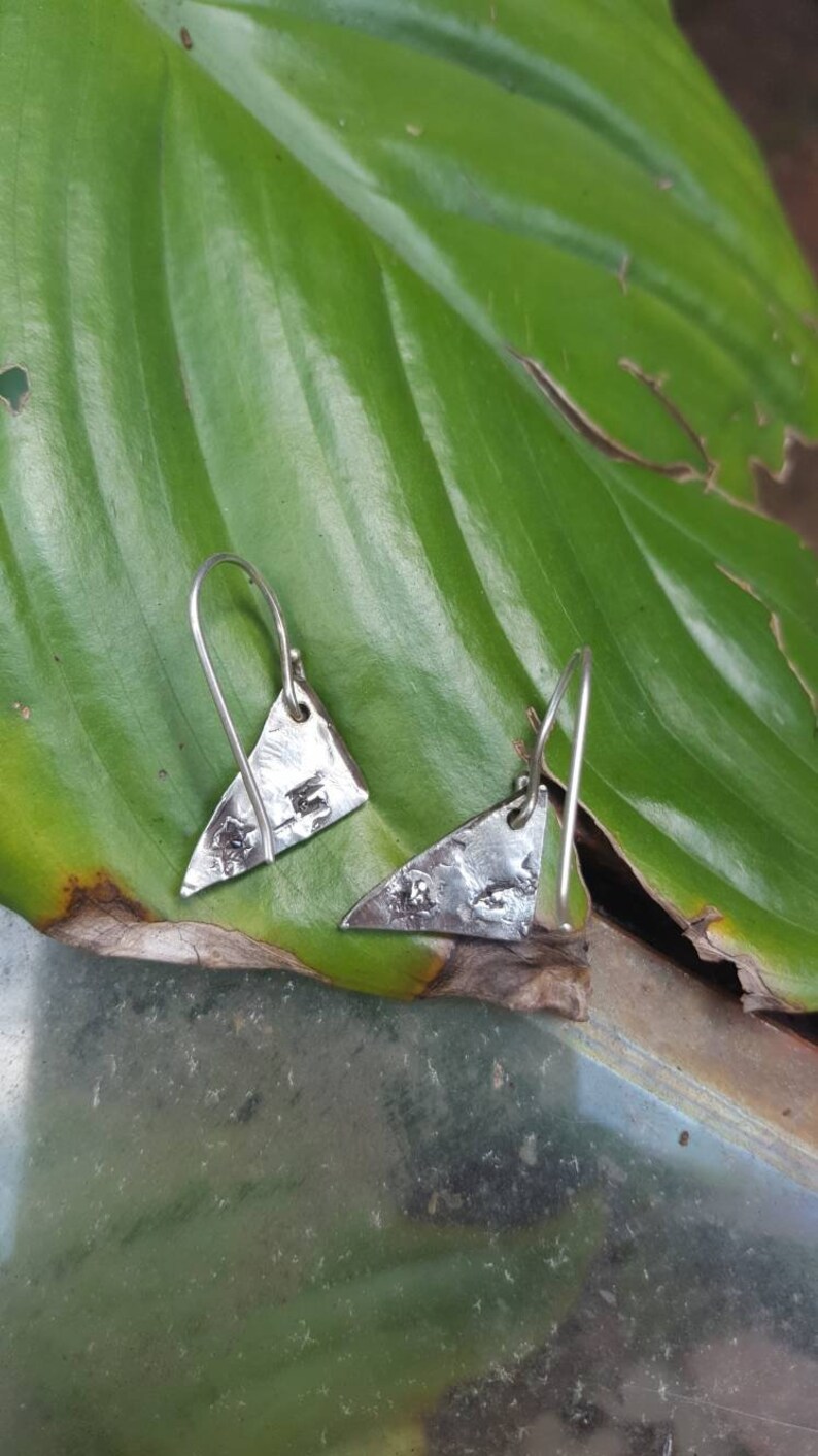 Geometric cast in place earrings