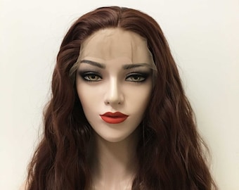 May include: A long, wavy, auburn brown lace front wig with a natural-looking parting. The wig is styled in loose waves and has a soft, natural texture.