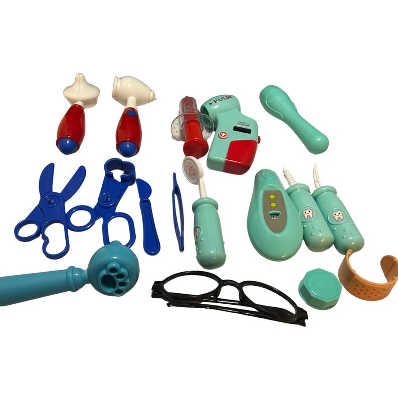 May include: A collection of toy medical tools, including a stethoscope, scissors, and a blood pressure monitor. The set features various colors, including blue, red, and teal. Also included are toy glasses, a bandage, and dental tools.