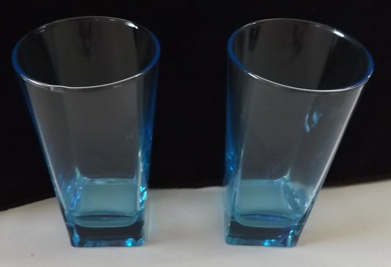 Two Blue Tall Drinking Glasses Round Top and Square Bottom 