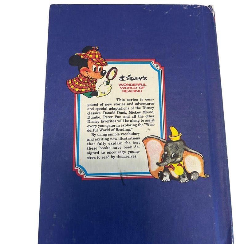 May include: A vintage Disney's Wonderful World of Reading book. The back cover features illustrations of Mickey Mouse and Dumbo. Text on the cover describes the series' focus on Disney classics and its aim to encourage young readers.