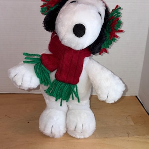 May include: A rustic wooden sign with the text "Welcome to our home" in a handwritten style. The sign features a distressed finish and a simple, inviting design, perfect for a front porch or entryway.