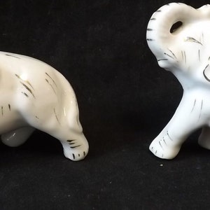 Two White Porcelain Elephant Figures - See Description for Details
