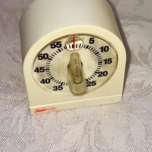 May include: A rustic wooden sign with the text "Welcome to our home" in white lettering. The sign features a distressed finish and a simple, inviting design, perfect for a front porch or entryway.