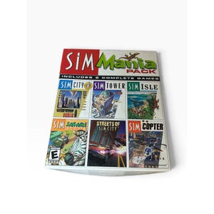 May include: A white rectangular box for the SimMania Pack video game collection. The cover features the title in red and green text, with six individual game panels: SimCity, SimTower, SimIsle, SimSafari, Streets of SimCity, and SimCopter.