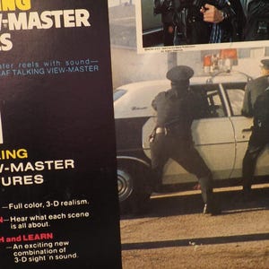 May include: A vintage Talking View-Master Reels package with the number 21 in large white font. The package includes a photo of police officers near a white car. The text reads "TALKING VIEW-MASTER PICTURES."