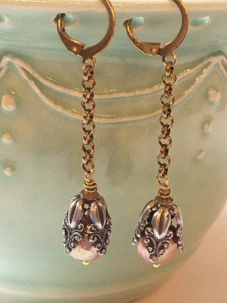 Vintage inspired long pearl earrings with silver floral cap and brass chain