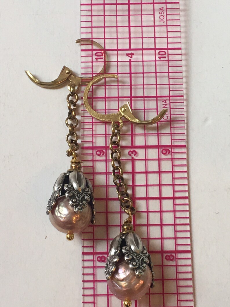 Vintage inspired long pearl earrings with silver floral cap and brass chain
