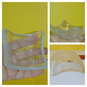May include: Three clear glass dishes with a textured, bubbly surface. The dishes are different shapes and sizes.