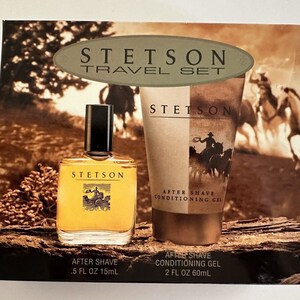 May include: A travel set of Stetson aftershave products. The set includes a 0.5 fl oz (15 ml) bottle of aftershave and a 2 fl oz (60 ml) bottle of aftershave conditioning gel. The packaging features a brown and tan background with a cowboy riding a horse.