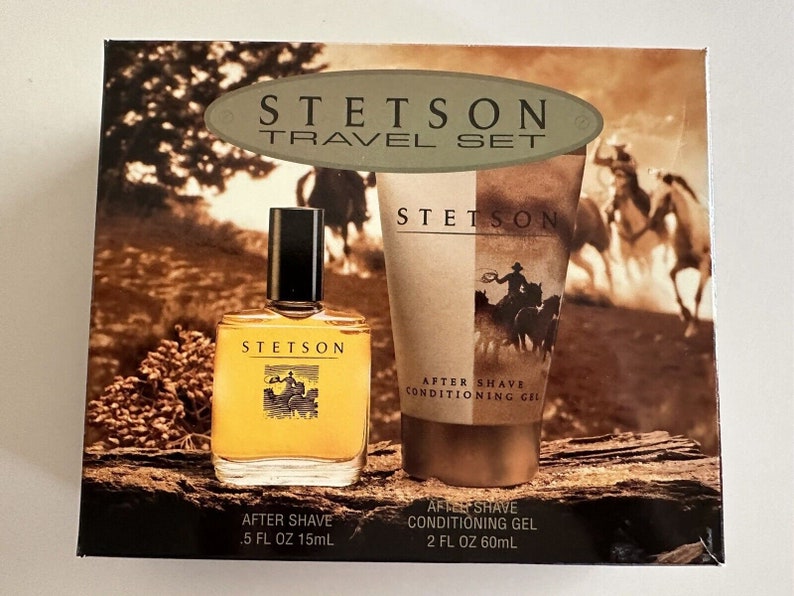 May include: A travel set of Stetson aftershave products. The set includes a 0.5 fl oz (15 ml) bottle of aftershave and a 2 fl oz (60 ml) bottle of aftershave conditioning gel. The packaging features a brown and tan background with a cowboy riding a horse.