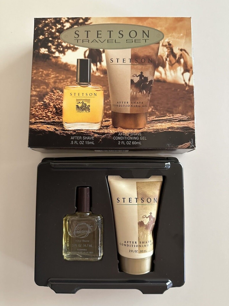 May include: A travel set of Stetson aftershave products. The set includes a 0.5 fl oz bottle of aftershave and a 2 fl oz tube of aftershave conditioning gel. The packaging is brown and features a cowboy riding a horse.