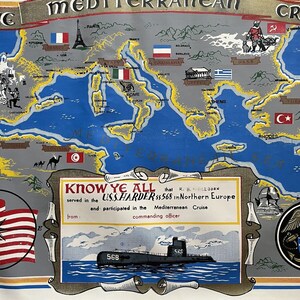 May include: A vintage map of the Mediterranean Sea with a blue background and yellow borders. The map shows the countries of Europe, Africa, and Asia. The map is surrounded by a white border with a blue and gold trim. The text "KNOW YE ALL" is printed in a white box with a blue and gold trim. The text "that R. B. WALLBORN served in the U.S.S.HARDER $$ 568 in Northern Europe and participated in the Mediterranean Cruise from: commanding officer" is printed below the box. A submarine is shown in the lower right corner of the map. The text "568" is printed on the side of the submarine.