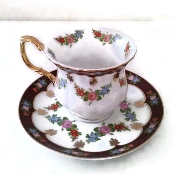 Vintage  Footed Teacup and Saucer   GNA    Fine Porcelain    Gold Trimmed Cup and Saucer.