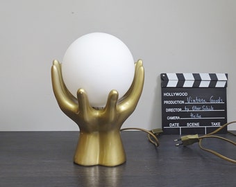 Vintage table lamp golden hands with glass ball, 80s lamp