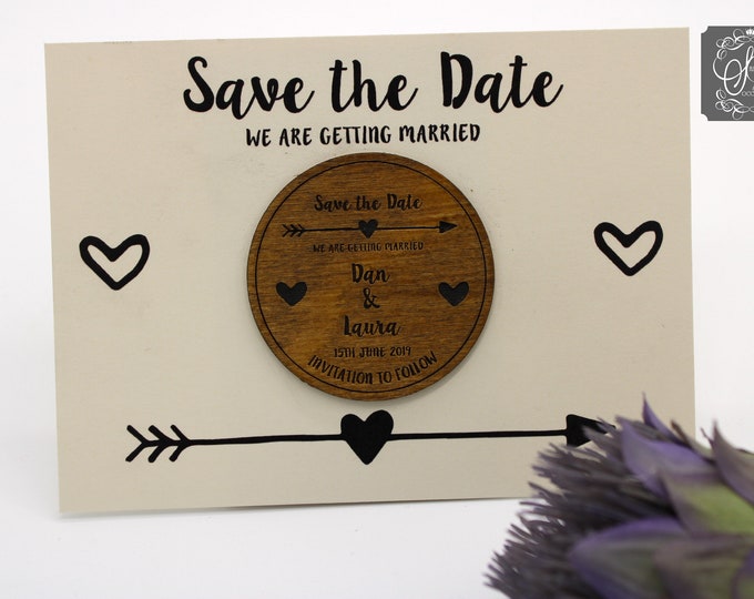 Wooden Save the Date Fridge Magnet with arrow and heart details ivory card