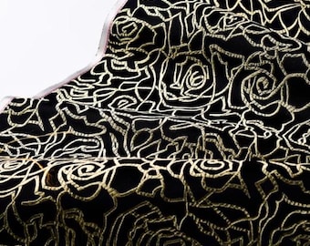 May include: Black fabric with a gold embroidered rose pattern.