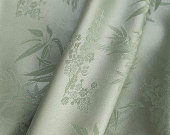 Light green color triacetate fabric with bamboo-leaf jacquard fabric, silk-like texture and satin