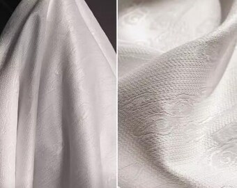 May include: White fabric with a subtle embossed pattern. The fabric is smooth and has a soft sheen.