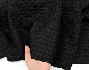 Zwarte jacquard, reliëfjacquardstof, gestructureerde modestof, jasjurkstof
