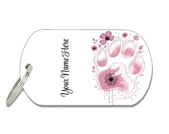 May include: White dog tag with a pink paw print and flowers. The text "Your Name Here" is printed on the tag.
