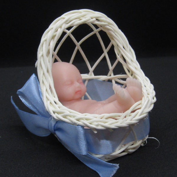 Mini silicone baby complete with crib