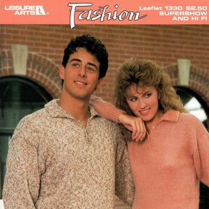 May include: A couple wearing sweaters, the man in a beige sweater with brown specks and the woman in a pink sweater. The woman is leaning on the man's shoulder. The image has the text "Leisure Arts Fashion Leaflet 1330 $2.50 Supershow and Hi Fi featuring nomotta Supershow and Hi Fi" at the top.