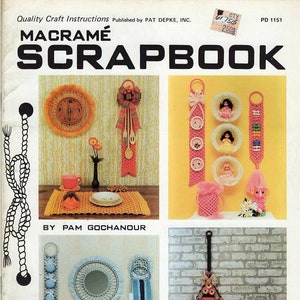 May include: A vintage macramé scrapbook cover featuring various macramé projects. The projects include a clock, wall hangings, and decorative items. The cover includes the text "MACRAMÉ SCRAPBOOK" and "Quality Craft Instructions".