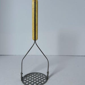 Vintage Flint Stainless Vanadium Yellowish color Handle Potato Masher USA 9.5