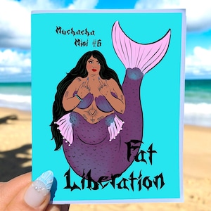 May include: A greeting card with a turquoise background featuring a mermaid illustration. The mermaid has dark hair, purple scales, and a pink tail. The card reads "Muchacha Mini #6" and "Fat Liberation" in black script.
