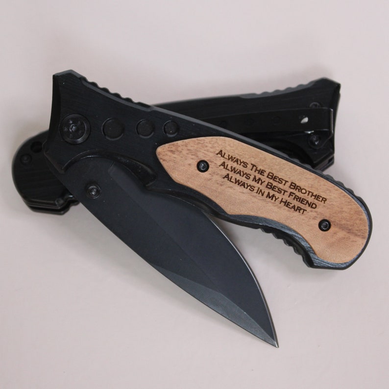 May include: Black pocket knife with a wooden handle engraved with the message "Always the best brother, always my best friend, always in my heart."