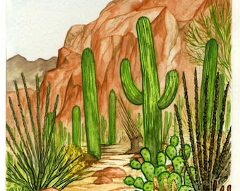 May include: A watercolor painting of a desert landscape featuring tall green saguaro cacti, prickly pear cacti, and spiky ocotillo plants. The scene includes a sandy path winding through reddish-brown rock formations under a pale blue sky.