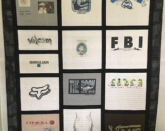 May include: A quilt made from various t-shirts, featuring logos and designs from brands like Quiksilver, Volcom, O'Neill, and Vans. The quilt also includes a photo of a baby and the text "You only live once".