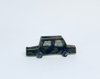 Green/brown mini car sculpture