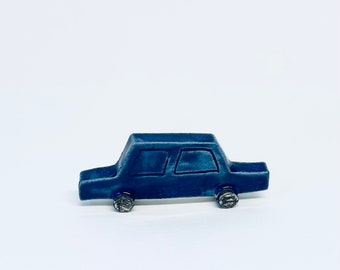 Dark blue mini car sculpture
