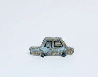 Pearly blue mini car sculpture
