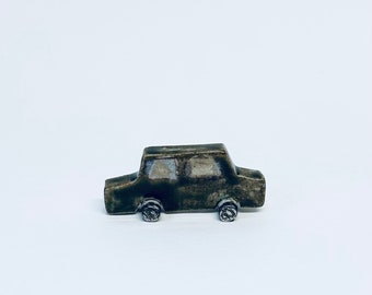 Green/brown mini car sculpture