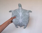 Cuddly turtle plush toy.