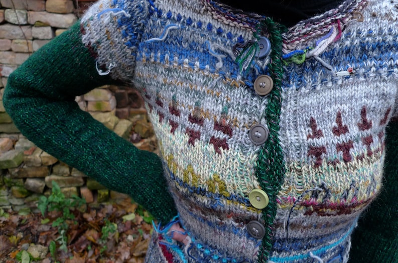 Handmade grey striped wool cardigan with green sleeves and buttons