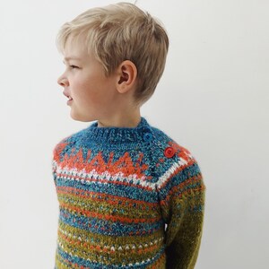 Hand knitted childs Icelandic Style Fair Isle sweater in warm green with a bright Fair Isle pattern