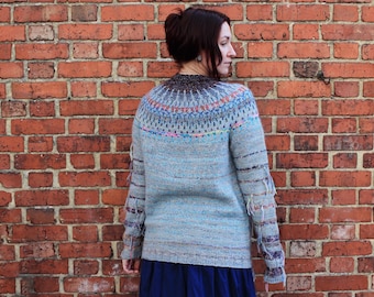 Handmade knitted soft wool gray and light blue Icelandic style sweater with an Icelandic style pattern