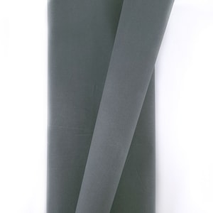 May include: Two pieces of dark grey fabric folded together. The fabric is smooth and has a slight sheen.