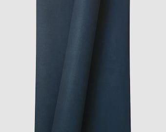 May include: A roll of dark blue fabric. The fabric is folded in half and the edges are visible.