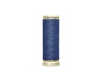 May include: A spool of Gütermann thread in a dark blue color. The spool is labeled with the brand name and the length of the thread: 100 m - 110 yds/vgs.